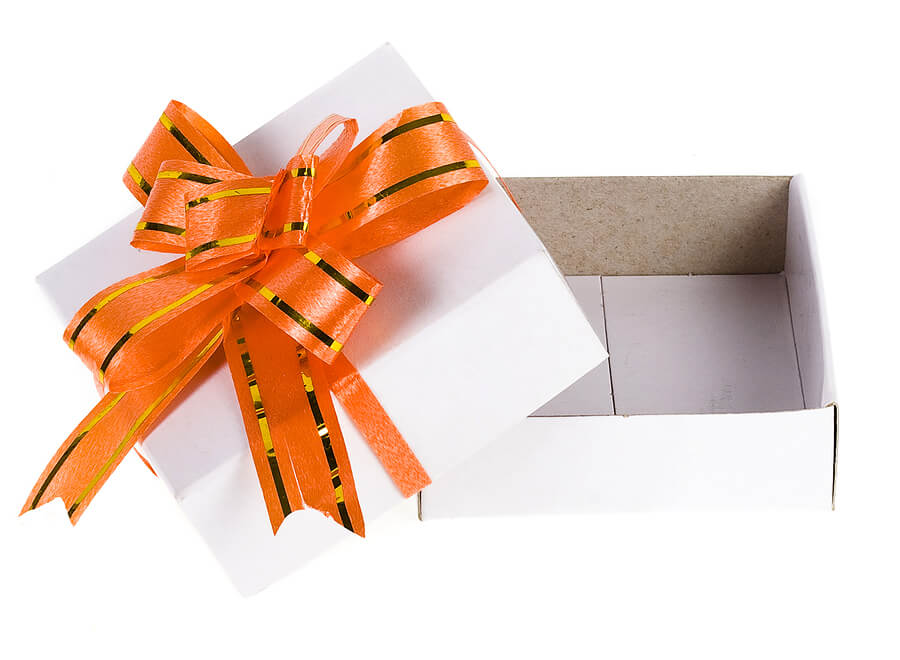 Halloween candy leftovers, white gift box with orange bow