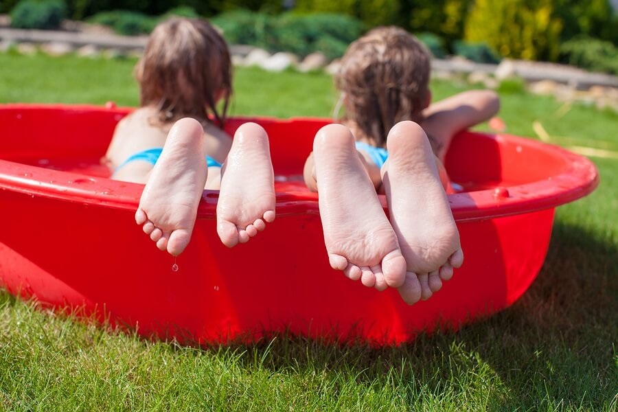Close up of feet in kiddie pool